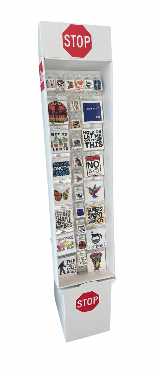 Vinyl sticker display box featuring assorted large and small stickers in a peggable floor-ready wholesale display for retail stores